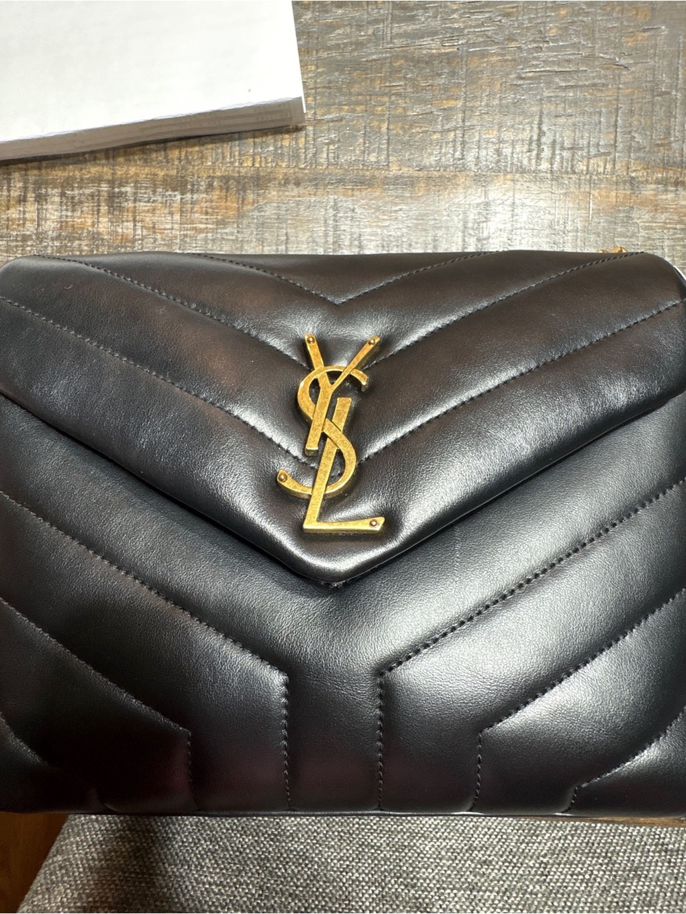 Small Saint Laurent Loulou shoulder bag in black matelassé leather